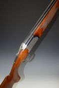 Browning Medalist 12 bore over and under ejector shotgun with named and ornately engraved lock,