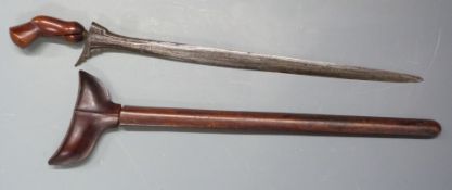 Kris dagger with plain wooden grip, wooden sheath and 39cm blade. PLEASE NOTE ALL BLADED ITEMS ARE