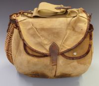 Vintage wicker fishing creel with external canvas and leather pockets.