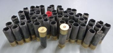 A collection of mainly Remington No.70 8 bore empty shotgun cartridge cases.
