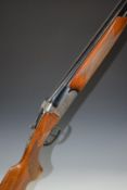 Domino12 bore over and under ejector shotgun with engraved lock, trigger guard, underside, top plate