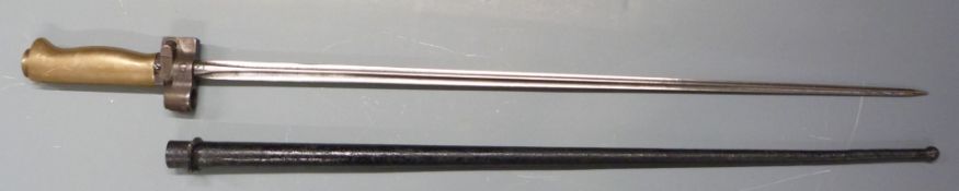 French Lebel 1886/93 bayonet with brass grip, stamped F.C to 51cm cruciform blade, with scabbard.
