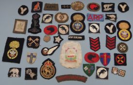 Collection of British Army cloth badges, divisional patches including 30th Corps, 4th Armoured