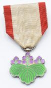 A white metal Japan Order of the Rising Sun medal set with enamel, in lacquered box