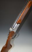 Midland 12 bore over and under shotgun with engraved lock, underside, trigger guard, top plate and