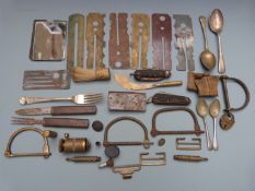 Quantity of military ephemera including locks, clasp, knives, mirror, button slides, cuttlery etc
