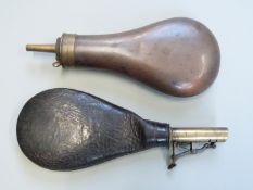 Leather shot pouch together with a copper and brass powder flask, largest 20.5cm long.