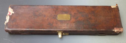 Charles Fisher leather bound gun case with fitted interior, brass lock and name plate, embossed