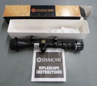 Simmons 800878 8-Point 3-9x40 rifle scope with lens covers and scope mounts, in original box.