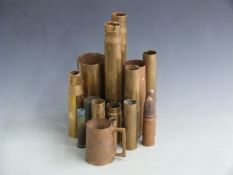 Small collection of WW1 and WW2 shell cases, largest 38cm tall
