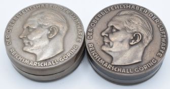 Two Nazi style snuff/ pill boxes, one metal the other part Bakelite, both featuring Reichmarshall