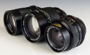 Three Vivitar SLR camera lenses comprising 28mm 1:2.0, 135mm 1:2.8 62mm and 135mm 1:2.8 55mm