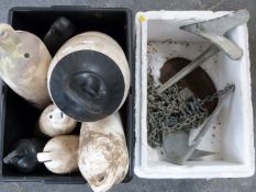 Two galvanised plough anchors with chains, a collection of fenders of various sizes, largest