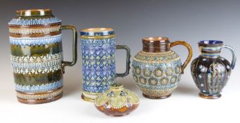 Four pieces of Doulton Lambeth comprising four jugs and a squat vase, two signed by Henrietta