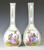 A pair of Dresden porcelain pedestal bottle vases with alternate Watteau / flower decoration, H31.