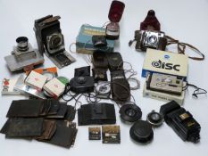 Cameras and accessories to include Goerz folding camera with Rada back, Zeiss Tessar 1:3.5 f=10.5cm,