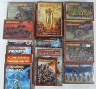 A collection of Warhammer table top wargame figures and books together with six sealed figure sets