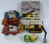Four Tonka pressed steel construction vehicles together with a five piece steel Buddy L Brute