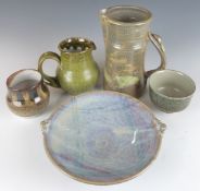 Five pieces of studio pottery including Ray Finch for Winchcombe and Hugh West pedestal dishes,  jug