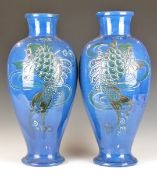 A pair of 19thC Brannam Pottery pedestal vases with incised fish decoration, H41cm, unmarked