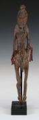 Sepik River, Papua New Guinea Oceanic carved ancestor figure on stand, H 33cm