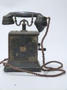 Ericsson cast iron and wood vintage telephone with Cable & Wireless Ltd logo to front