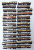 Twenty-six Tri-ang and Tri-ang Hornby 00 gauge model railway coaches in crimson and cream liveries.