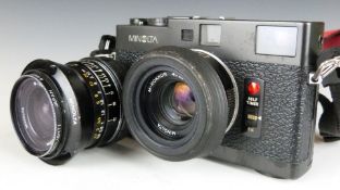 Minolta CLE 35mm camera, serial number 1007103 with M-Rokkor 40mm 1:2 lens, together with a
