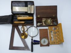 A 19thC set of travelling beam scales, cased set of weights, two compasses, one marked F.Barker &