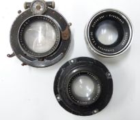 Three camera or similar lenses comprising Schneider Kreuznach 1:5.6/150 Componon, Zeiss Tessar 1:4.5