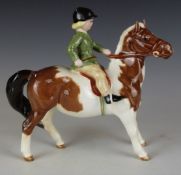Beswick girl on a skewbald pony, H14.5cm