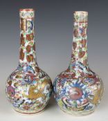 A pair of 19thC Chinese clobbered vases with dragon decoration, H16cm