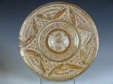 An 18th/19thC Hispano Moresque (Moorish) pottery charger with convex centre and low relief copper