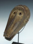 African tribal Baule carved baboon mask on bespoke stand, height on stand 39cm