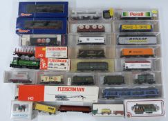 Twenty-nine Bachmann, Fleischmann and Roco 00 gauge model railway locomotives, and wagons