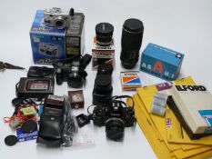 Cameras and accessories including Canon A1 SLR with 50mm 1:1.8 lens, Tamron 17mm 1:3.5, Tokina 70-