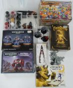 A collection of Warhammer and Warhammer 40,000 role-playing and table top wargame miniatures, some