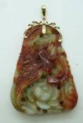 Chinese carved jade pendant depicting a dragon and phoenix, with 14k gold mount