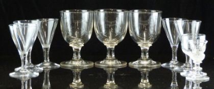 Ten 18th/19thC clear glass drinking glasses, including a set of three and a set of five, largest