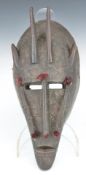 African tribal carved and horned Marka mask with beaten metal decoration, H34cm. Provenance:- part