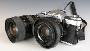 Fujica AX-5 SLR camera with 50mm 1:1.6 lens, together with a Tamron SP 35-80mm 1:2.8-3.8 lens with