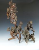 Three Chinese figural root carvings of emaciated immortals and young Buddha, probably late 19th/