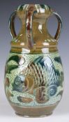 Lauder Barum three handled vase decorated with fish, signed to base, H19cm