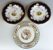Three Coalport cabinet plates including a reticulated example with relief, enamelled and gilt