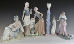 Three large Nao figures comprising a pair of water carriers, girl with puppy and Japanese