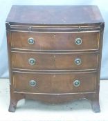 Bow front mahogany bachelor's chest of three drawers with brushing slide above, W70 x D46 x H74cm