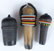 Three carved African tribal Sambu carved horn snuff bottles, two with beaded decoration, vendor