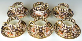 Thirteen pieces of Royal Crown Derby Imari tea ware decorated in the 2451 pattern,