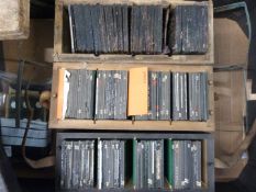 Three boxes of educational glass slides, mostly plants and animals, some marked Flatters & Garnett