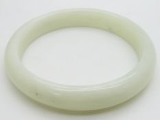 A 19thC Chinese mutton fat jade bangle